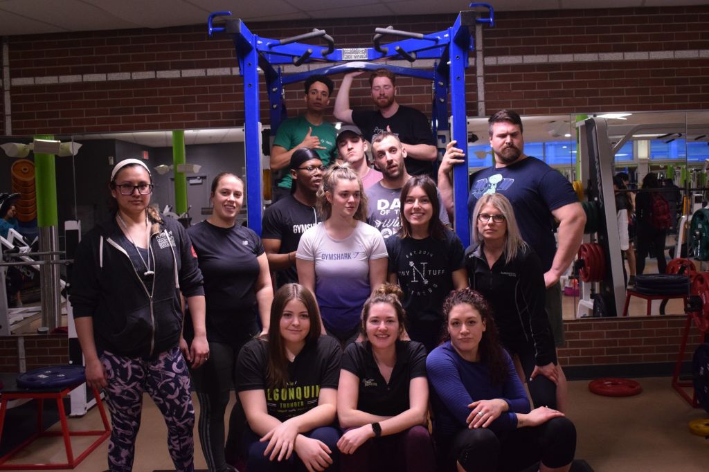 Participants and staff of the Fitness zone's 2020 squat competition celebrate another another successful powerlifting event.